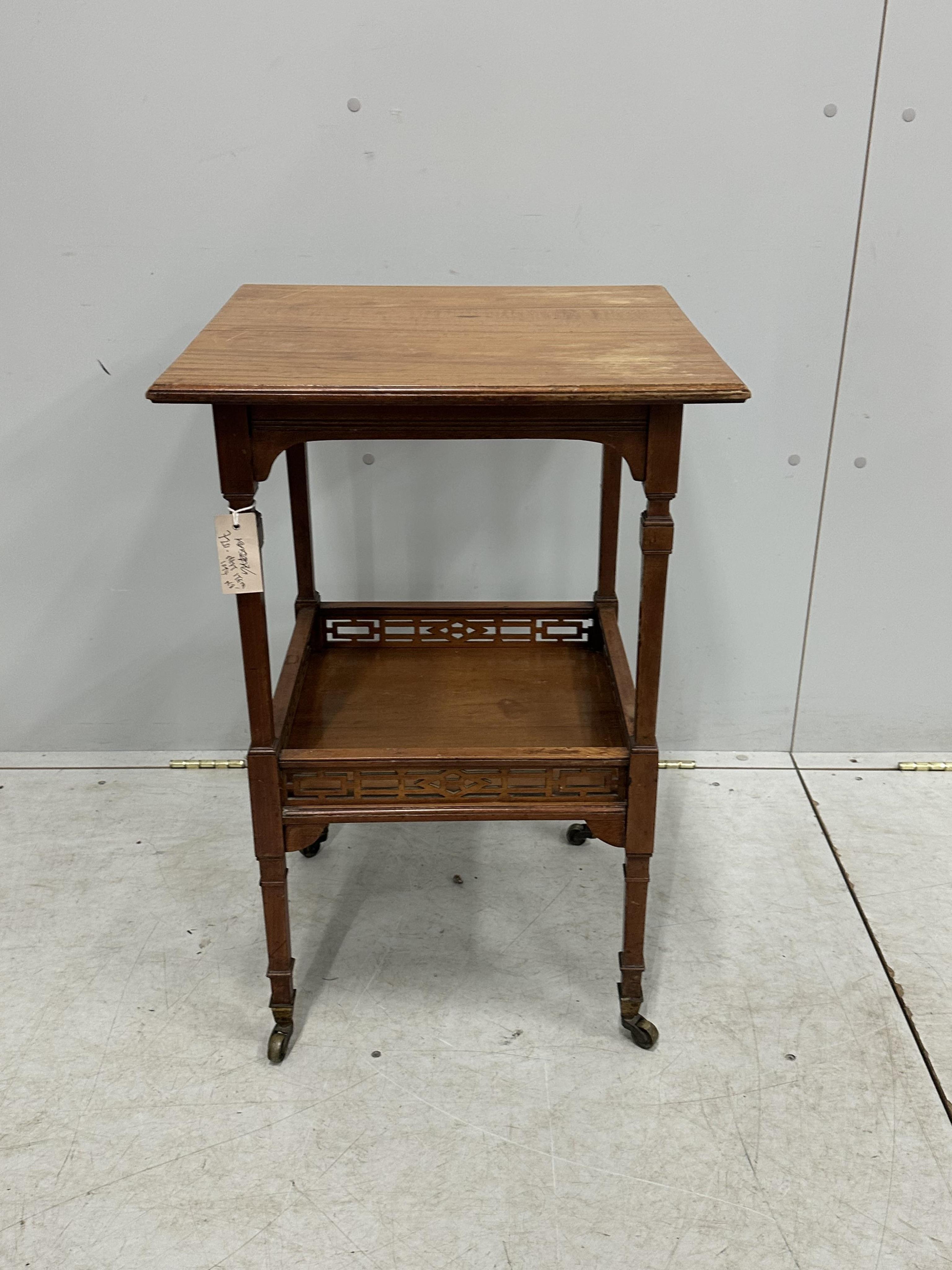 A late Victorian Aesthetic Movement satinwood two tier occasional table, width 48cm, depth 47cm, height 73cm. Condition - fair